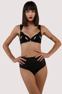 model wears Anita black mesh cut out bow bra with lingerie set