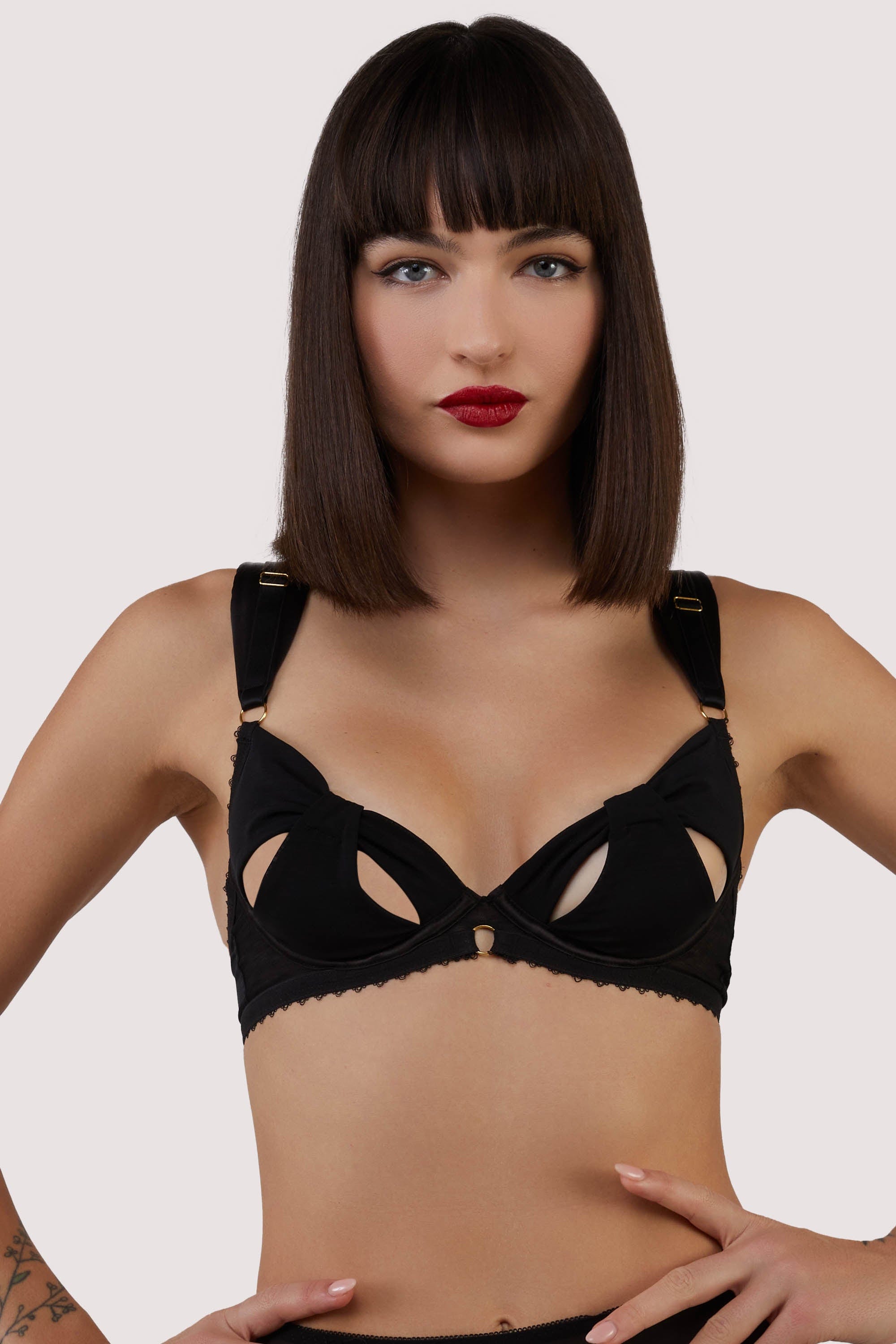 model wears Anita black mesh cut out bow bra