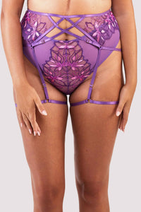 4 strap suspender with purple straps over the stomach, hips and thighs.