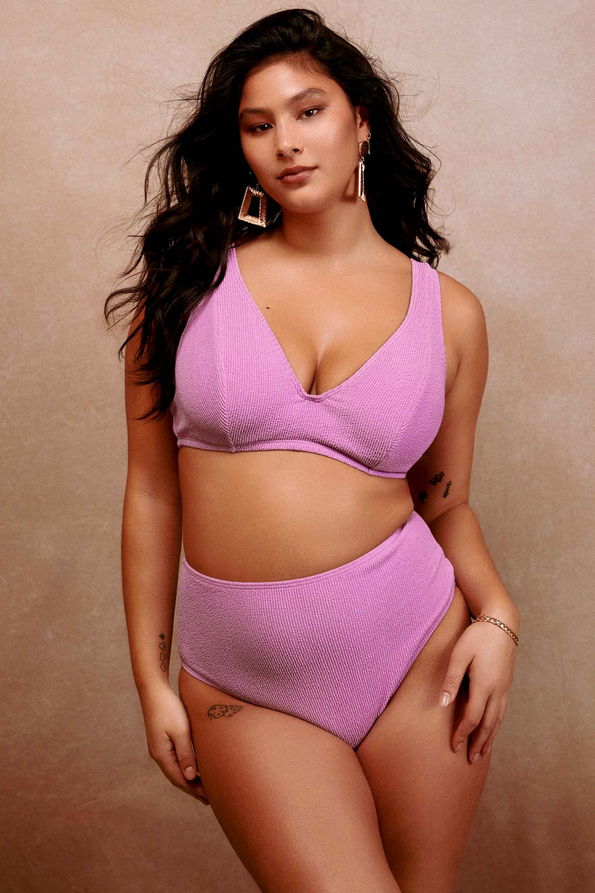 model wears lilac scrunch fabric bikini swimwear set