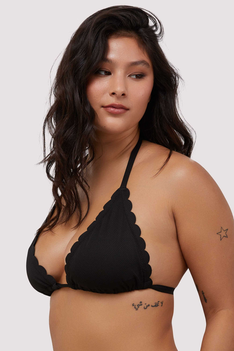 model shows side angle of black scalloped edge triangle bikini top