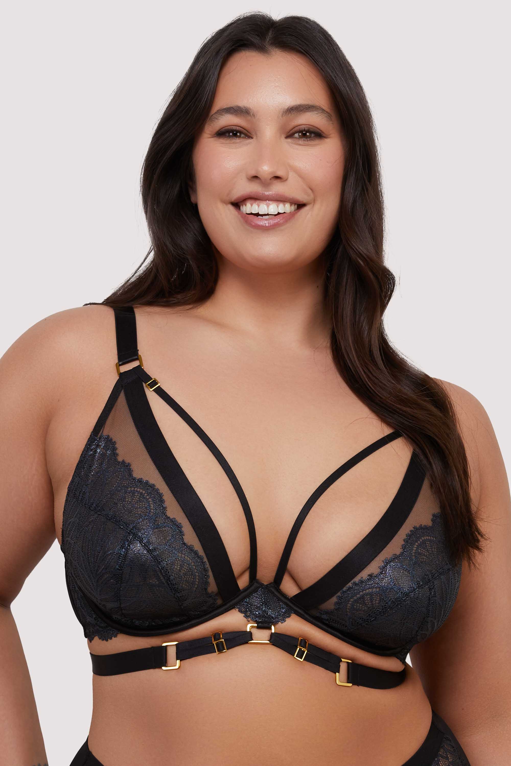 model wears black lace plunge bra with straps