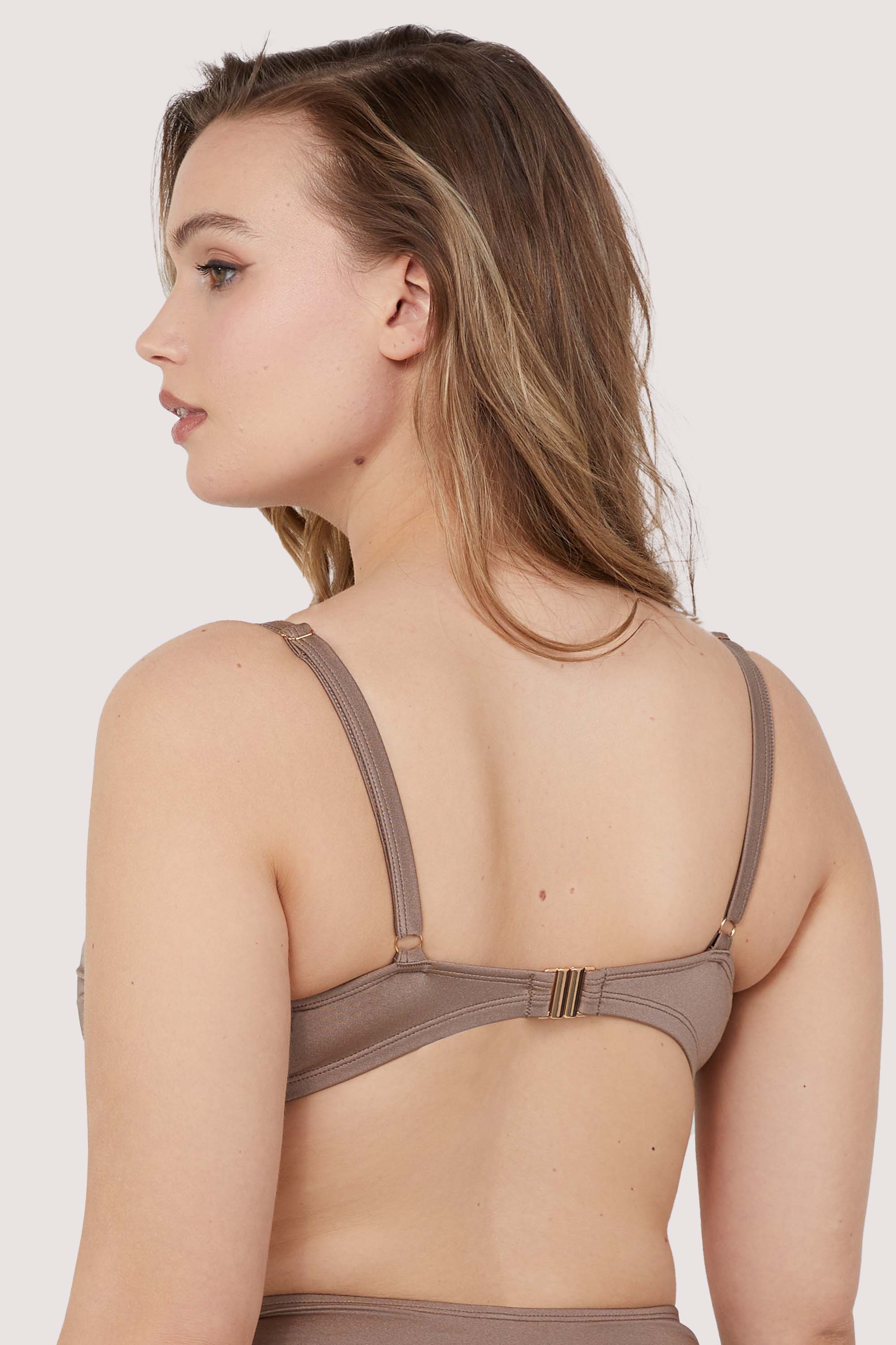 Model shows taupe bikini clip fastening back band and adjustable shoulder straps