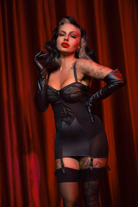 retro model wears black lace corselette with stockings
