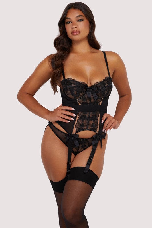 Model wears a black floral embroidery basque with a floral embroidery, satin bows and underwired cups.