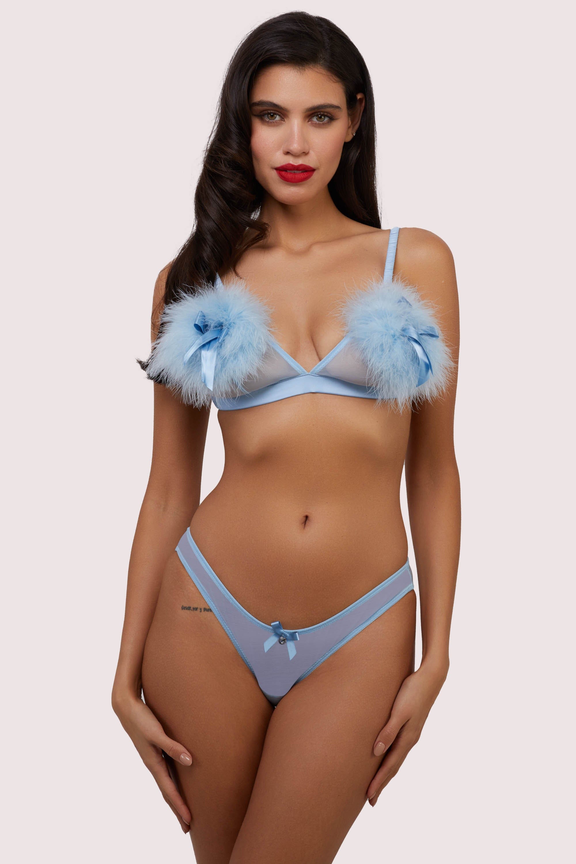 model wears blue triangle bra with feather puff