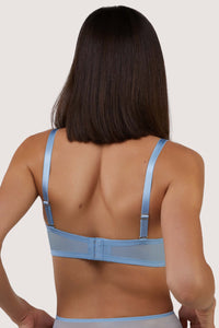 Core:model shows hook and eye fastening back of bra