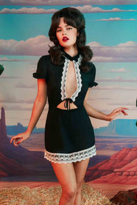 Black vintage style babydoll dress with cutout detail, lined with black and white lace.