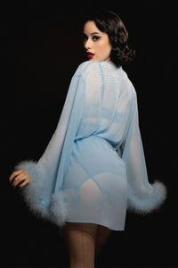 model shows back of sheer blue robe with diamantes