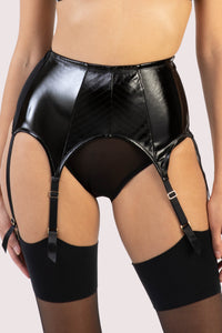 model wears Genevieve black pvc suspender belt