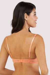 Back view of a mesh and lace orange bra with lilac/blue lace accents and bows.