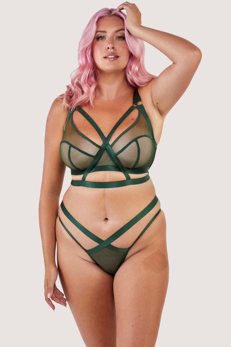 Green satin harness style bra with mesh panelling, seen with a matching brazilian brief.