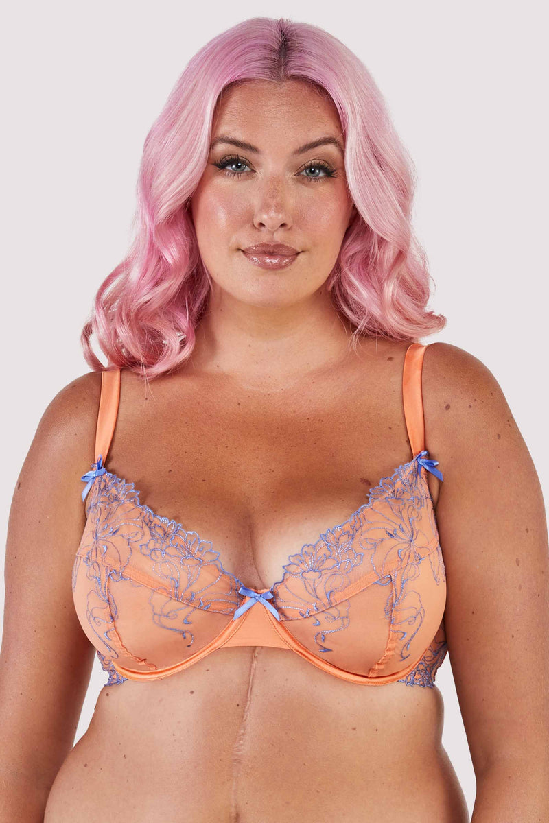Mesh and lace orange bra with lilac/blue lace accents and bows.