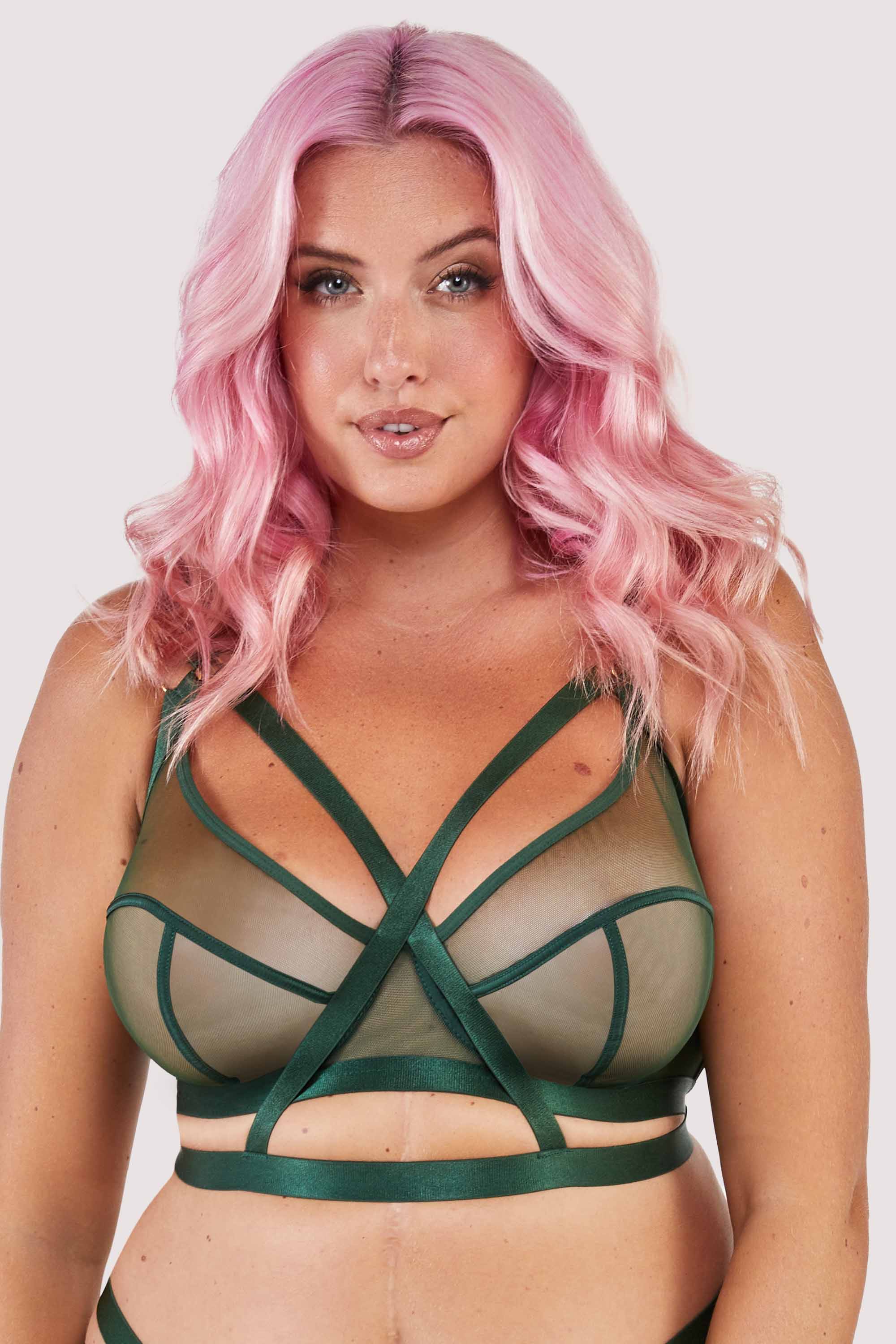 Dark green mesh balcony bra with satin harness detailing on the bust and ribs.