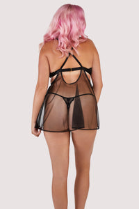 Black babydoll dress with lace and peephole cutouts on the bust and a flowing mesh dress with matching thong.