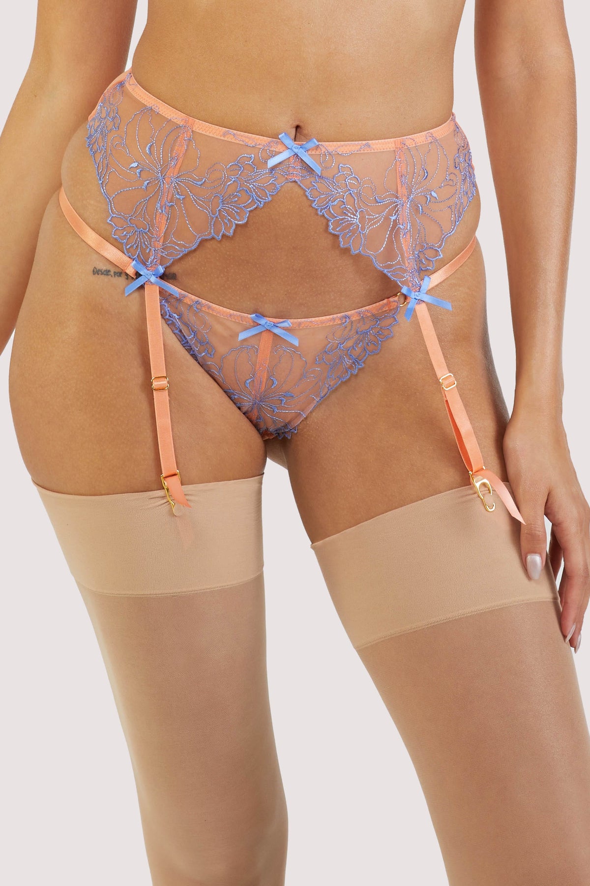Orange mesh suspender with lacey blue-lilac detailing on the front.