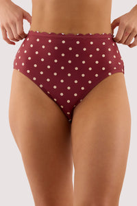 Model wears a hazel wine spot high waist bikini brief and high waist, high-leg style and full coverage featuring lined gusset.