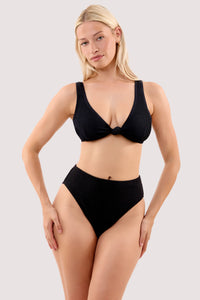 Model wears a selene black crinkle knot front bikini top with a matching high waist bikini bottom.