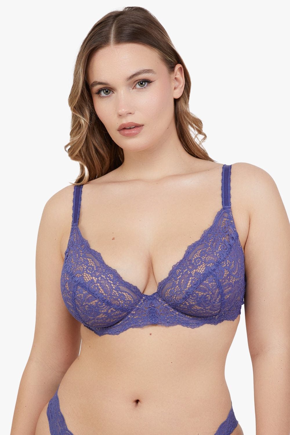 model wears lace bra in Space Dust Blue with underwire and adjustable straps