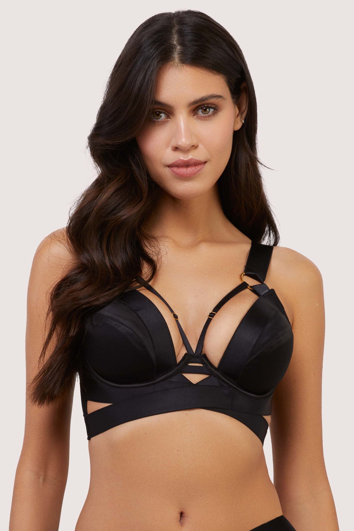 model wears balck stain and mesh plunge bra with straps
