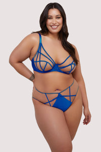 model wears cobalt blue bra and high waist thong lingerie set