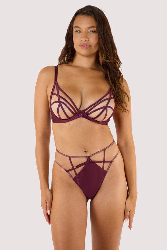 Model wears a wine plunge bra featuring a satin caged, strap detailing, and full mesh cups with underwired, with a matching wine high waist brief.