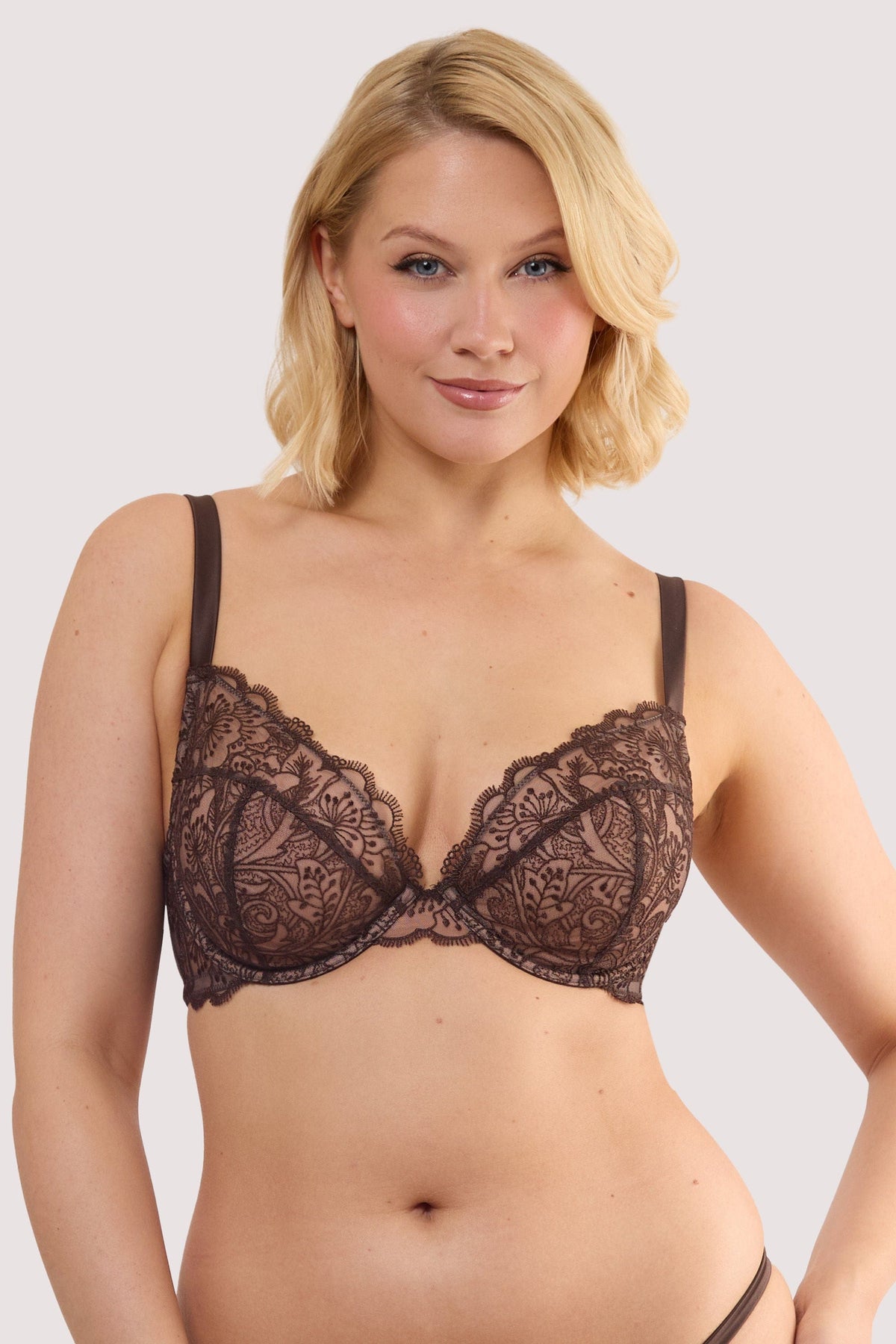 Model wears a sierra brown embroidery plunge bra with sheer mesh with bronze floral embroidery and underwired plunge cups featuring scalloped lace trim.