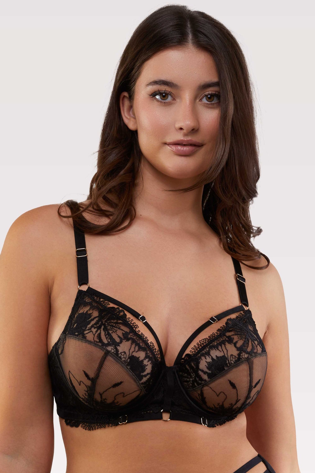 model wears black lace bra with straps