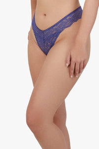 Model Side view of thong in Space Dust Blue, featuring soft stretch lace and a flattering V-shaped waistband