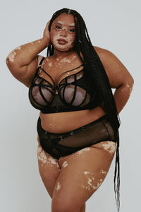 model wears Eddie Black Crossover bra with lingerie set