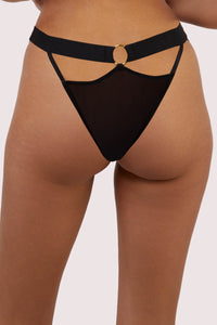 model shows the back of the black elastic and mesh brief