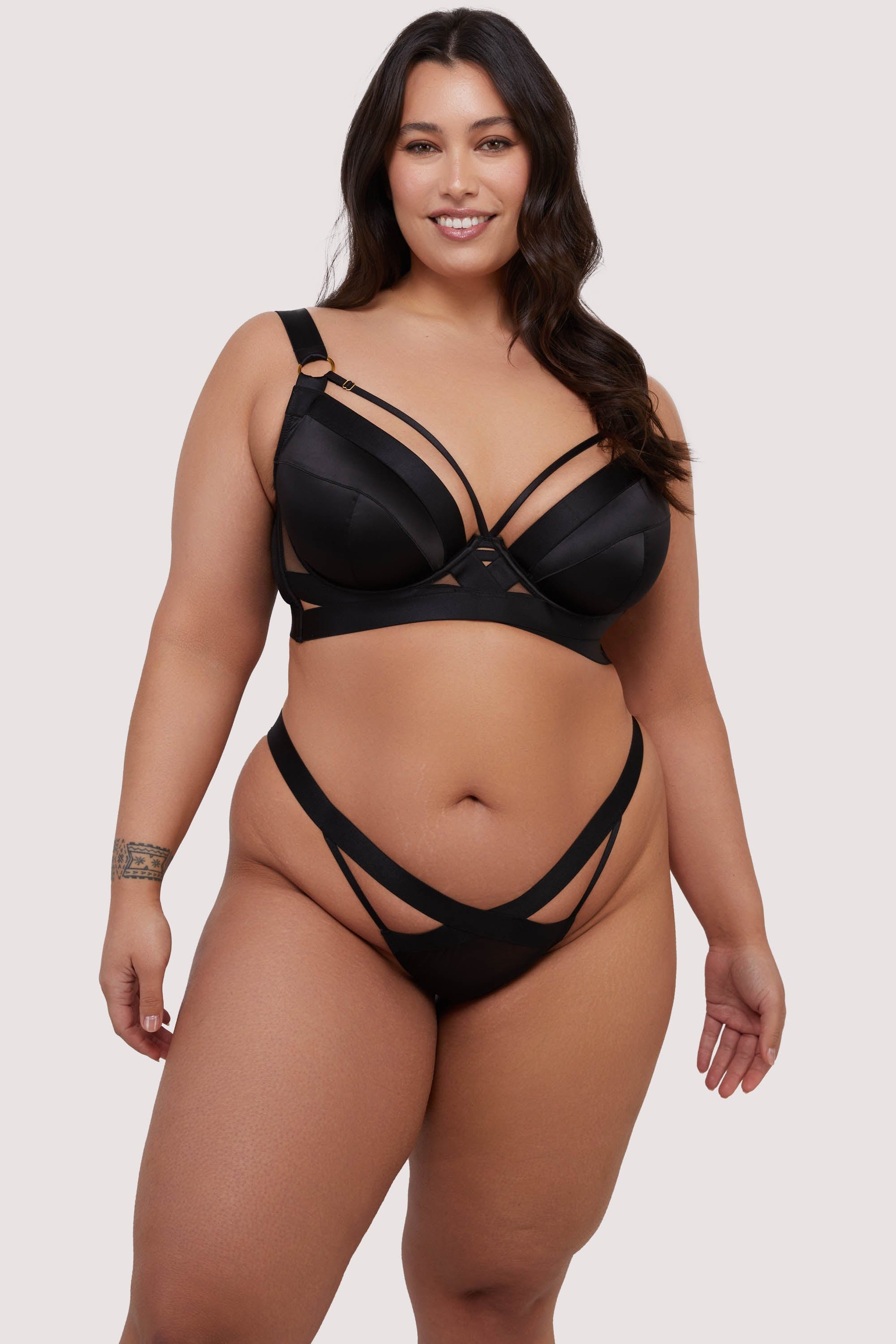 model wears black lingerie set with elastic and mesh brief
