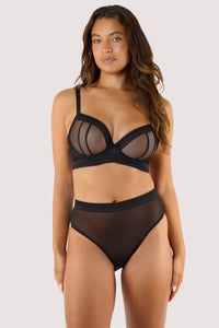 Model wears Sheer High Waist Brief in black paired with Sheer Plunge Bra for a bold, modern silhouette.