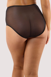 Model shows a back of high-waist brief featuring octopus embroidery, satin straps, and a sheer mesh.