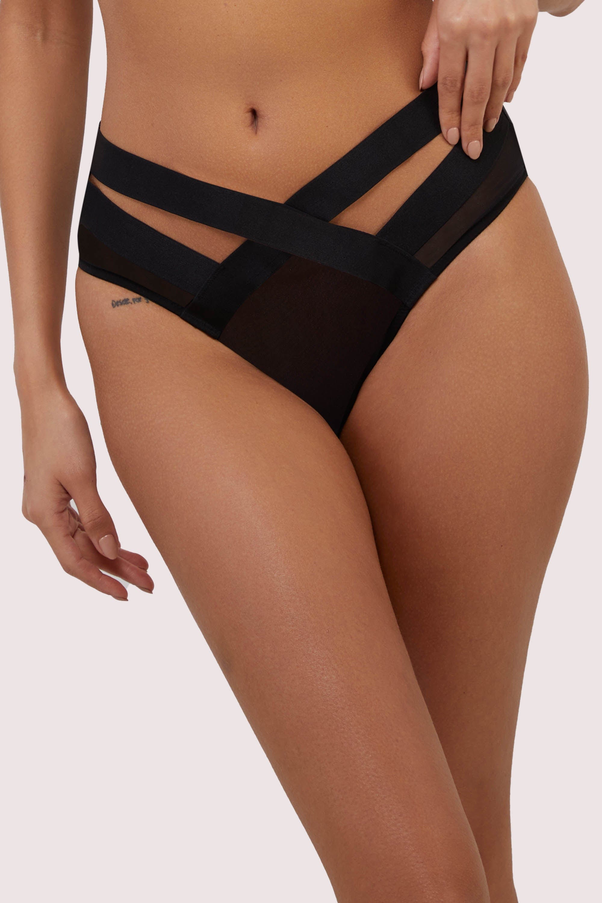 model wears black mesh high waisted brief