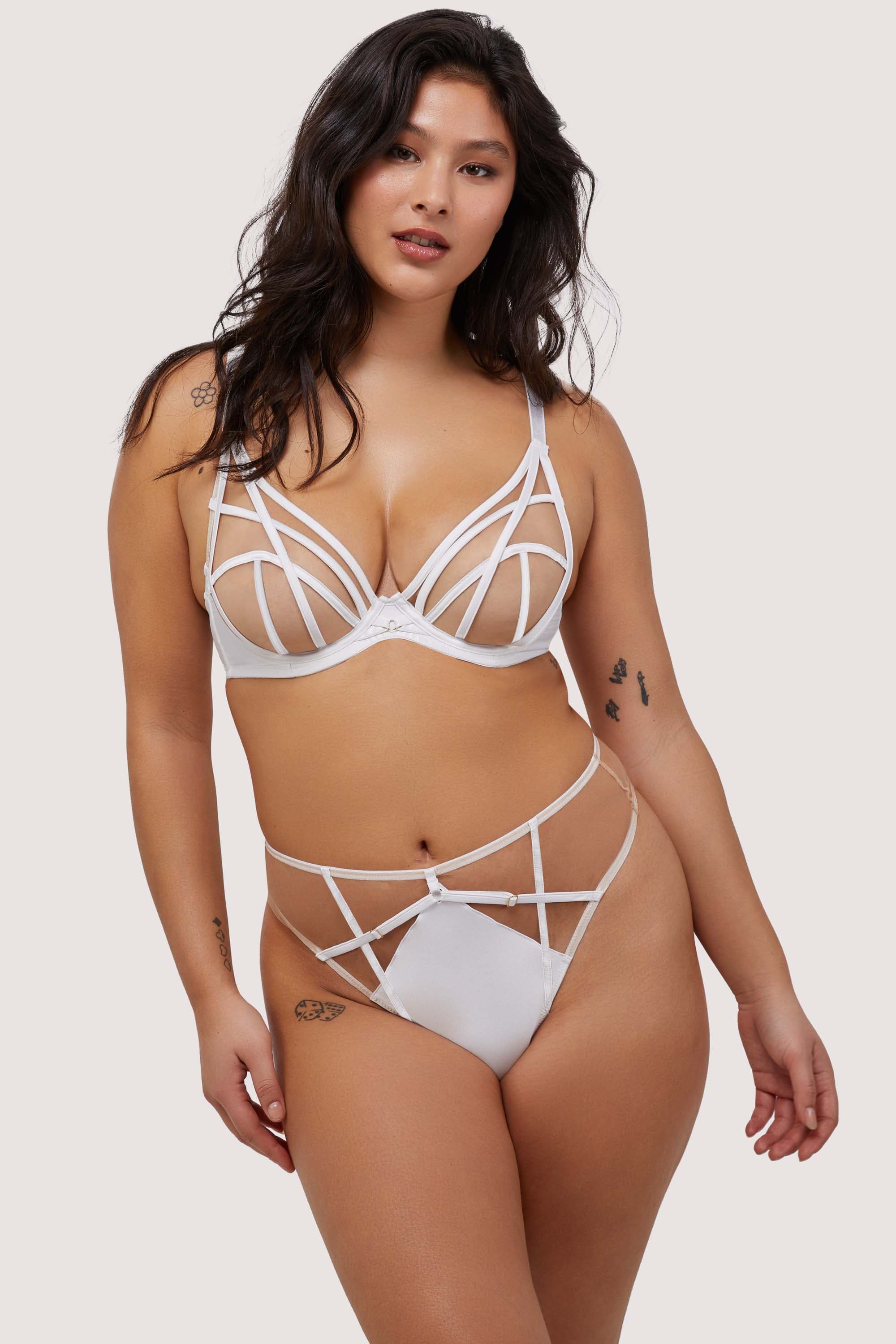 Model wears sexy white strap detail bra and thong set
