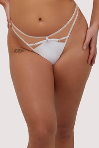 Model wears white strap detail thong