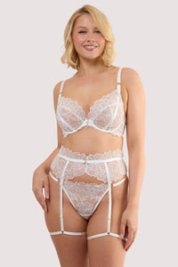 Model wears a willow white floral embroidery suspender belt with scalloped lace edges, with a matching embroidery bra and thong.