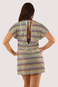 Model Back view of colorful crochet kaftan with a zig-zag design, highlighting its lightweight and flowing style.