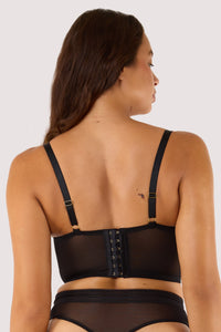 Model shows adjustable straps and hook any eye fastening back of black bustier
