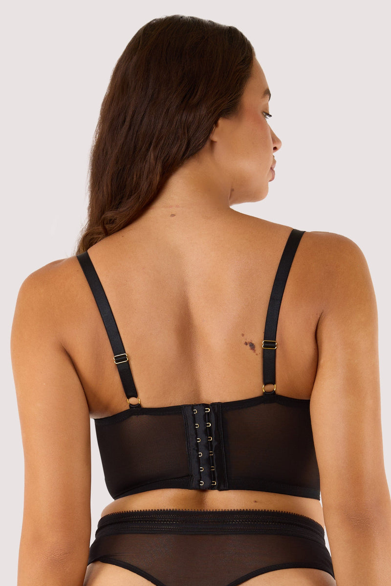 Model shows adjustable straps and hook any eye fastening back of black bustier