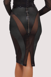 Model wears a black vegan leather mesh insert pencil skirt featuring leather panels with sheer mesh inserts with waist cinching, silhouette defining fit.