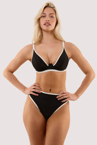 Model wears a ally black & ivory high waist bikini brief with a matching bikini top.