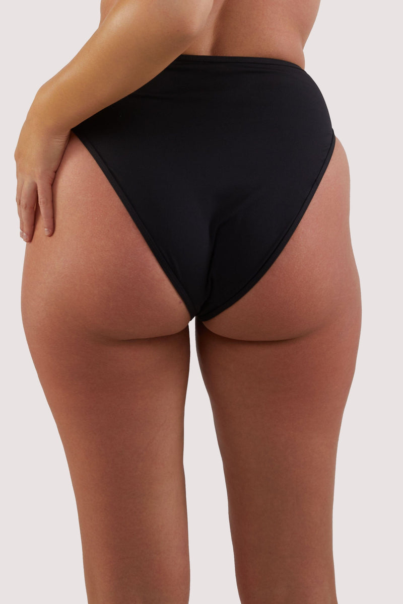 model shows full brief back of high-waist and high-leg bikini bottoms