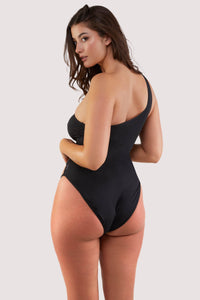 fuller bust model shows full brief back of asymmetric black swimsuit