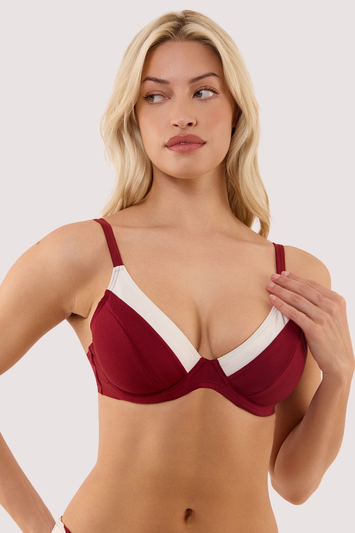 Model wears a stasia wine and ivory fuller bust underwired bikini top with ivory contrast trim, supportive underwired cup.