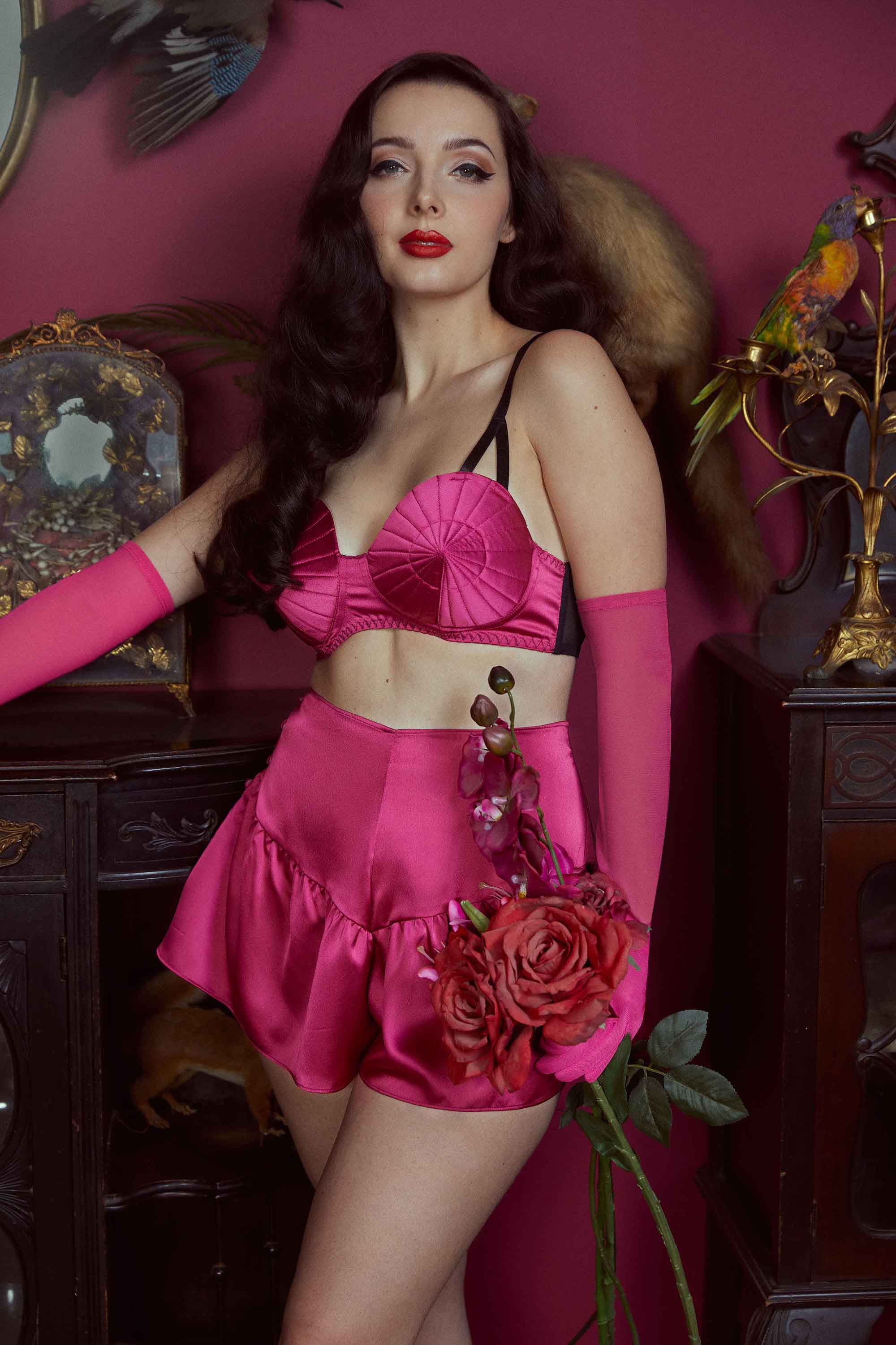 https://www.playfulpromises.com/cdn/shop/products/bettie-page-lingerie-bra-hot-pink-retro-futuristic-bullet-bra-29355091492912_2000x.jpg?v=1642696261