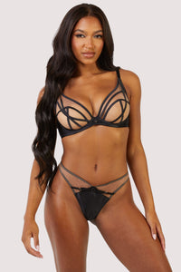 model wears the black mesh bra and black mesh thong